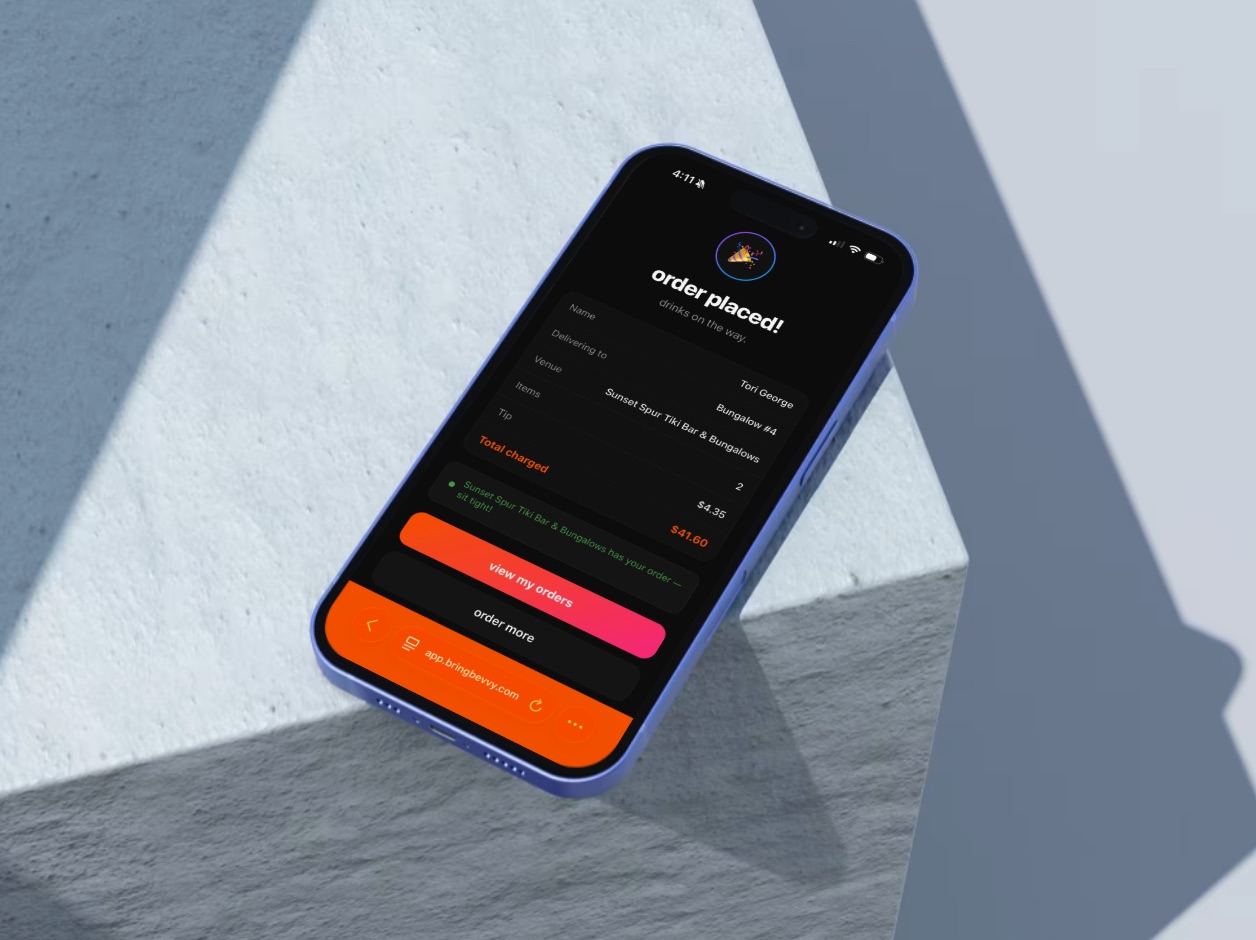 A phone showing a BringBevvy order confirmation for a delivery to Bungalow 4